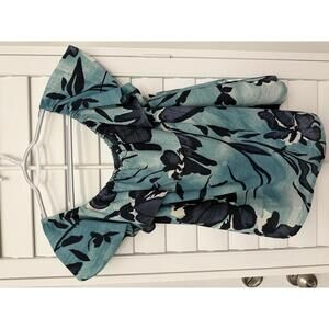 Anthropologie Maeve Islander off-the-shoulder top in a blue and black floral